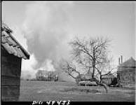 House burning from tank fire of the Black Watch (5th Brigade) 8 Apr. 1945