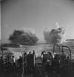 Depth charges explode astern of a frigate during trials Jan. 1944