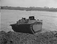Buffaloes coming ashore of the river Ijssel with members of the Kings Own Yorkshire Light Infantry 13 Apr. 1945