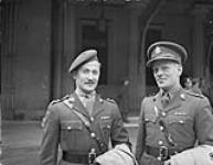 Lieutenant Osborne Alexander Robertson and Lieutenant Ritchie McVean Grainger receive Military Cross at Buckingham Palace 6 Mar. 1945