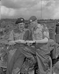 Captain Harvey, adjutant Gloucestershire Regiment (left), visits Captain A.G. Fergus, The Royal Canadian Regiment 10 June 1951