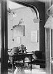Interior of sitting room, 54 (29?) Main Street [between 1895-1905].
