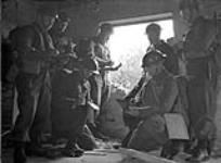 Group of soldiers taking notes probably during 48th Highlanders manouevres c.a. 1941
