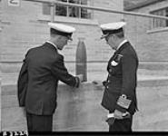 Chief of Naval Staff inspecting Japanese shell from Estevan Point 9 July 1942