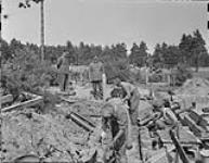 Lt. Gen. P.J. Montague and Lt. Gen. J.C. Murchie examining a building project underway at the Brookwood Cemetery 19 June 1945