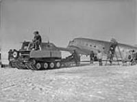 Dakota aircraft being unloaded of technical equipment and luggage - Operation Musk-Ox 20 Mar. 1946