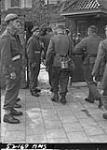German troops filing into barracks where they are disarmed by members of the Royal Canadian Regiment 11 May 1945