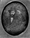Unidentified man with a beard wearing a wide brim hat, which he is touching with his left (right?) hand ca. 1850-1855