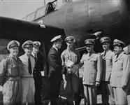 Ceremony marking transfer of Grumman 'Avenger' aircraft from the U.S. Navy to the Royal Canadian Navy. Lieutenant R.O. de Nevers is fifth from left. Other names are on the original photograph 5 Oct. 1950