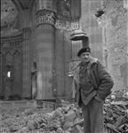 General Sir Bernard L. Montgomery standing in nave of ruined church 13 Dec. 1943