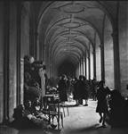 Bombed out civilians living temporarily in a church with a few personal belongings 10-Jul-44