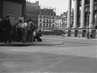 Civilians taking cover from snipers shooting during Gen. Charles de Gaulle's reception in 26 Aug. 1944