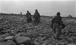 Inuit preparing for autumn caribou hunt at unidentified location in the Canadian Arctic ca. 1935