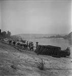 16th Field Engineers begin construction of pontoon bridge over the Seine River 27 Aug. 1944