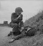 Captain R. Seaborne gives absolution to dying man on roadside 15-Jul-44