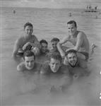 Front (left to right): Steward Del Chambers, Able Seaman "Cosy" Kozogovit, Able Seaman Dave Miller; Back: Instructor Lieutenant E.F. Smeathers and Leading Seaman Bruce Dunn of H.M.C.S. UGANDA, British Pacific Fleet 23 June 1945