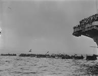 'War canoe'race. Whaler nearest camera is from H.M.C.S. UGANDA Apr. 1945
