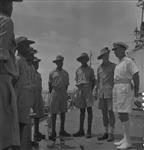 Capt. E. Rollo Mainguy with Ugandan soldiers aboard H.M.C.S. UGANDA 3 Mar. 1945