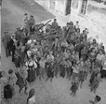 Italians greet Canadian troops enthusiastically as they pass through Sept. 1943