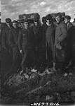 Group with prisoner wearing Dutch wooden shoes at Scheldt pocket embarkation point, West of Terneuzen 13 Ot. 1944