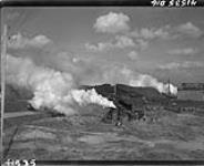Smoke machines along dyke, alligator on return trip carrying wounded prisoners and evacuees, Scheldt pocket embarkation point, West of Terneuzen 13 Ot. 1944