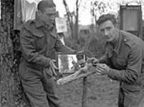 Captains Wilford and Melville, both of The Highland Light Infantry of Canada, working on a clay sculpture, England, 20 April 1944 April 20, 1944.