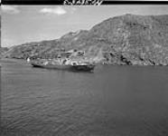 H.M.C.S. BOWMANVILLE leaving the harbour 28 June 1945