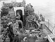 Infantrymen of The Highland Light Infantry of Canada aboard LCI(L) 306 of the 2nd Canadian (262nd RN) Flotilla en route to France on D-Day, 6 June 1944 June 6, 1944.