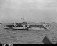 LCI(L) 299 of the 2nd Canadian (262nd RN) Flotilla carrying personnel of the 9th Canadian Infantry Brigade en route to France on D-Day 6 June 1944