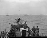 View from LCI(L) 306 of the 2nd Canadian (262nd RN) Flotilla, showing ships of Force 'J' en route to France on D-Day 6 June 1944