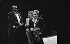 Conductor James de Preist, production assistant Gary Gilfillan and concertmaster Eugène Husaruk at Place des Arts. Montreal, Quebec, 1978 1978