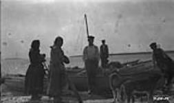 [Dene at a boat landing] Original title: Indians at boat landing 1924