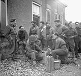 Signalmen of Le Régiment de Maisonneuve rewinding their lines, Ossendrecht, Netherlands, 17 October 1944 October 17, 1944.