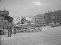 Canadian tanks of the 1st Canadian Infantry Division moving out of LST at arrival in. Marseilles, France, 6 March 1945 6 Mar. 1945