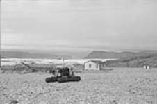 The helicopter of the Canadian Government ship D'IBERVILLE landing at the R. C. M. P. base - Twin Glacier trip Aug. 1953