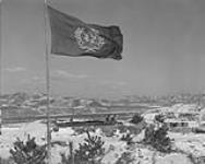United Nations flag flying over post near the Imjin River, Korea, February 1952 Feb. 1952