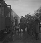 Canadians on leave climb aboard train to begin journey to England 31 Dec. 1944