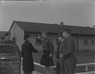 Lt. Col. A.J. Tedlie, C.O. of Cameron Highlanders of Ottawa (C.H. of O.), saying goodbye to High Commissioner Vincent Massey after his visit of Canadian Army Occupation Force Base. Gen Chris Vokes and his Aide-de-camp Maj. Wm. Mulhern appear at right 23 Mar. 1946