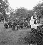 H/Major John W. Forth, Chaplain, presiding at a Holy Communion service for the Mortar Platoon of The Cameron Highlanders of Ottawa (M.G.) near Caen, France, 15 July 1944 July 15, 1944.