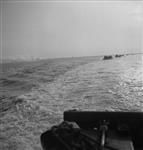'Buffalo' amphibious vehicles en route to Hoofdplaat with personnel of the North Shore Regiment passing smokescreen 11 Ot. 1944
