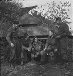 Personnel with 'Sherman' tank of the British Columbia Regiment. (L-R): Tpr. Earl Dixon, Cpl. Cliff Anderson, Tprs. Archie Allan, George Sodja, RSM Ralph Jay 14 Ot. 1944