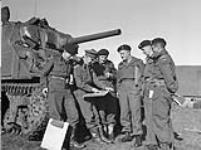 Officers holding an Orders ("O") Group in front of a Sherman tank of The Governor General's Foot Guards, Bergen op Zoom, Netherlands, 6 November 1944 November 6, 1944.