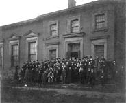 Assembly of members of the United Empire Loyalist Association in front of the old Parliament Buildings, Front Street c 1900