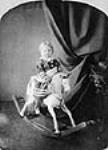 W.L. Mackenzie King on a rocking horse ca. 1876