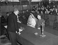 The wedding of Captain R.B. Menzies, Highland Light Infantry of Canada, and Miss Pamela van der Jagt in the town hall of Naarden, Netherlands, 18 October 1945 October 18, 1945.