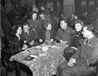 Personnel of 4th Canadian Armoured Division and fiancees.(L-R):Gnr. W.G. Dobbin & Wilhelmina De Groot, Gnr. R.A. Jennings & Rita Nies, Cpl. E.P. Weiss & Nancy Raven, Pte. N. Landry & Aaltaga Berends 16 Nov. 1945
