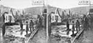 Streetscene showing sign for L.A. Blanc's Photographic Gallery vers 1870.