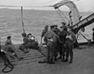 Unidentified soldiers preparing to disembark from H.M.C.S. PRINCE DAVID off the Normandy beachhead, France, 6 June 1944 June 6, 1944.