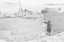 Inuk outside igloo 1950