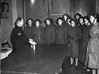 Personnel of the Canadian Women's Army Corps (C.W.A.C.) taking instruction in bomb-handling, London, England, 30 January 1943 January 30, 1943